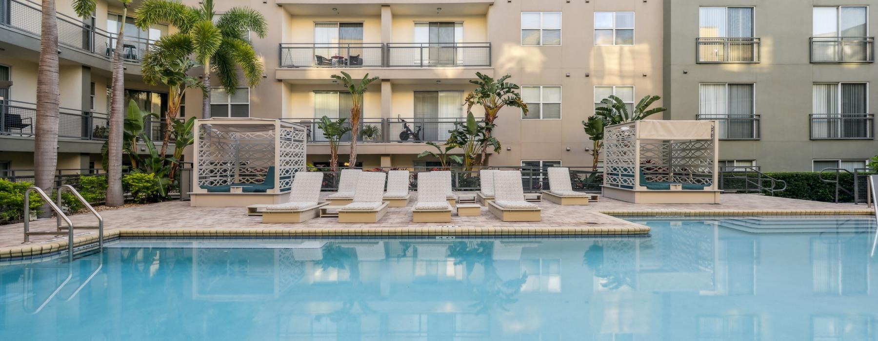 a swimming pool in front of a building