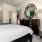 a bedroom with a bed and a mirror