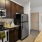 a kitchen with wooden cabinets