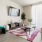 a living room with a red rug