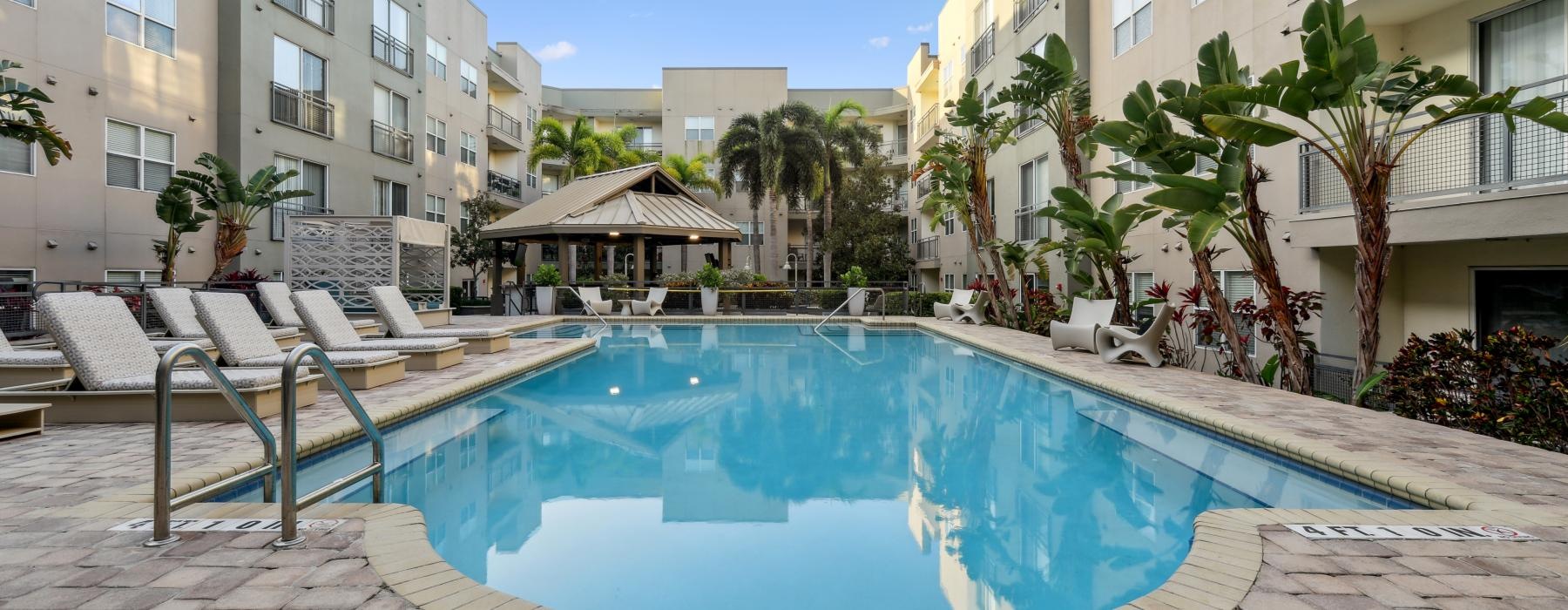 a pool in a courtyard between buildings