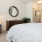a bedroom with a bed and a chair