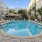 a pool in a courtyard between buildings