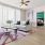 a living room with a pink rug