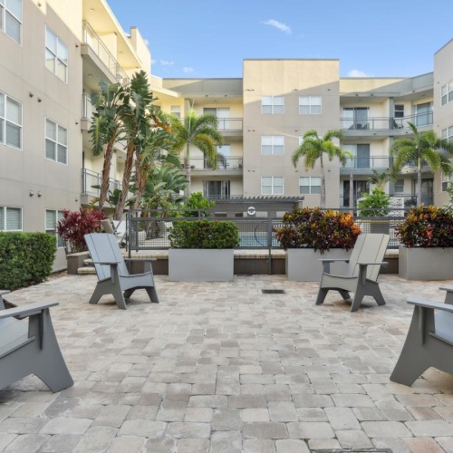 A new standard of living a courtyard with benches and plants