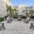 a courtyard with benches and plants