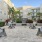 a courtyard with benches and plants