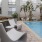a pool with chairs and a deck