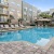 a swimming pool in front of a building