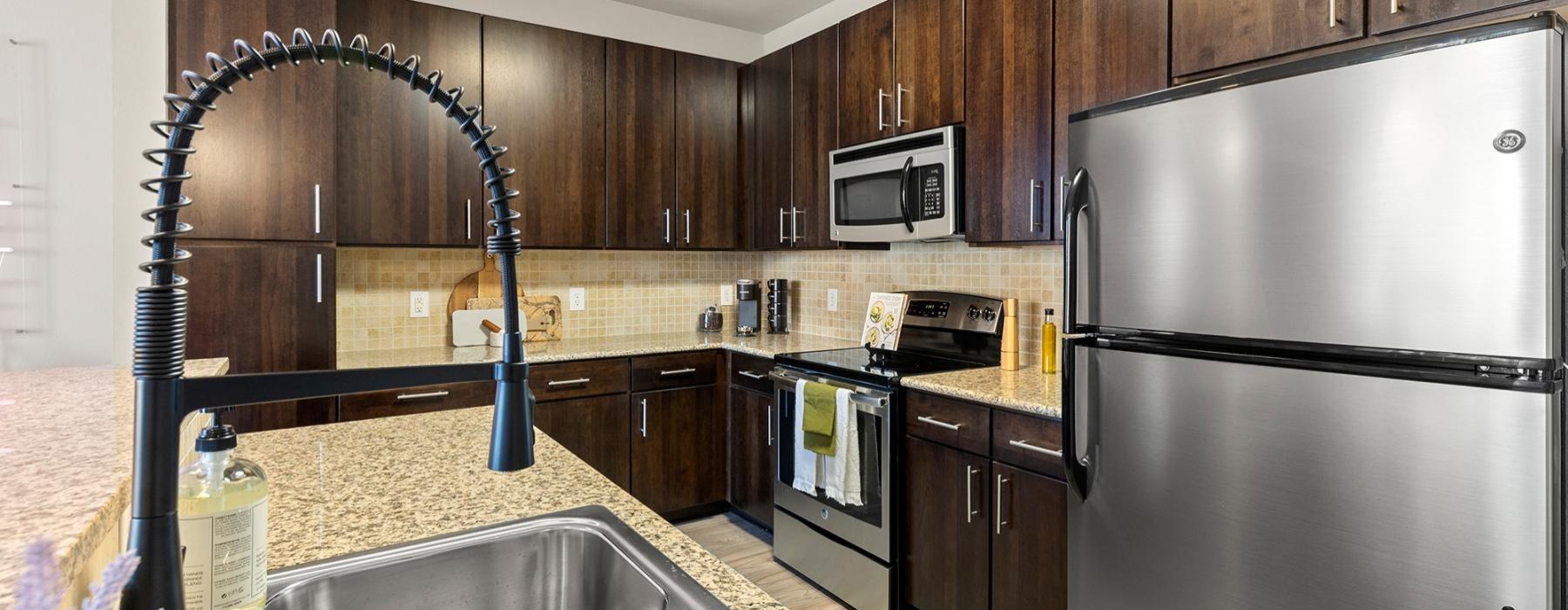 a kitchen with wooden cabinets