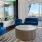 a room with blue chairs and a table