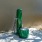 a green watering can