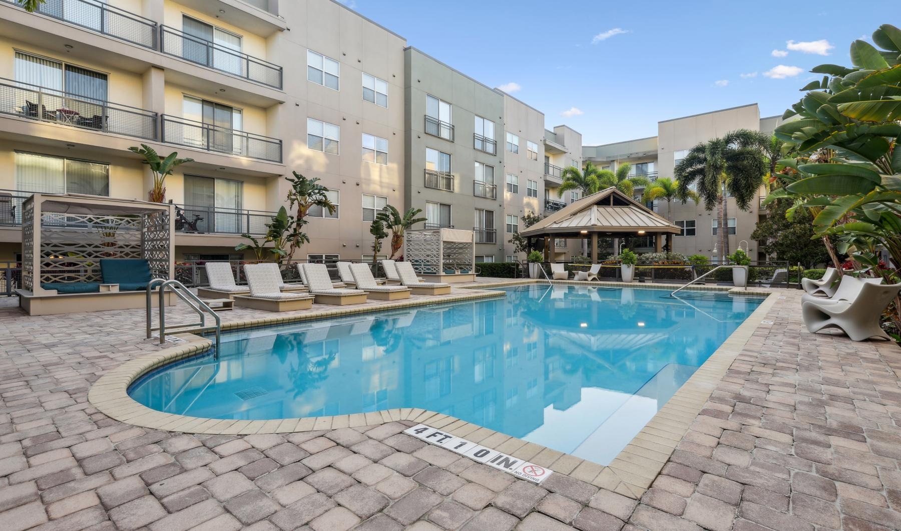 a swimming pool in front of a building