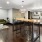 a large kitchen with a large bar and a couch
